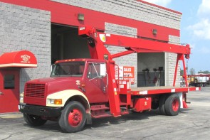 Simon RO TC2863 on 1997 International 4700 - Front Street Side